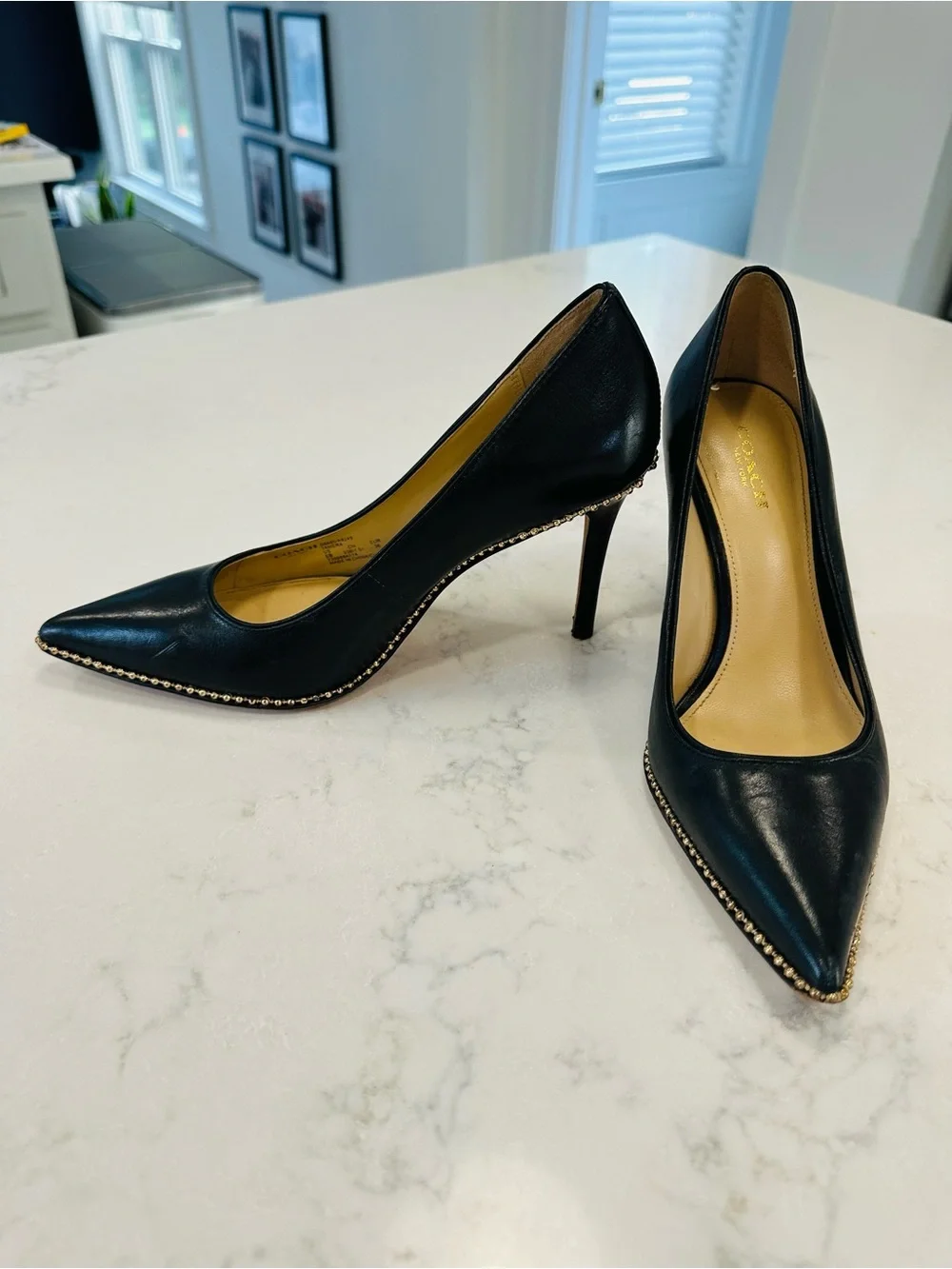Coach Tamera Black Leather Pointed Toe Pumps with Gold Beaded Accent